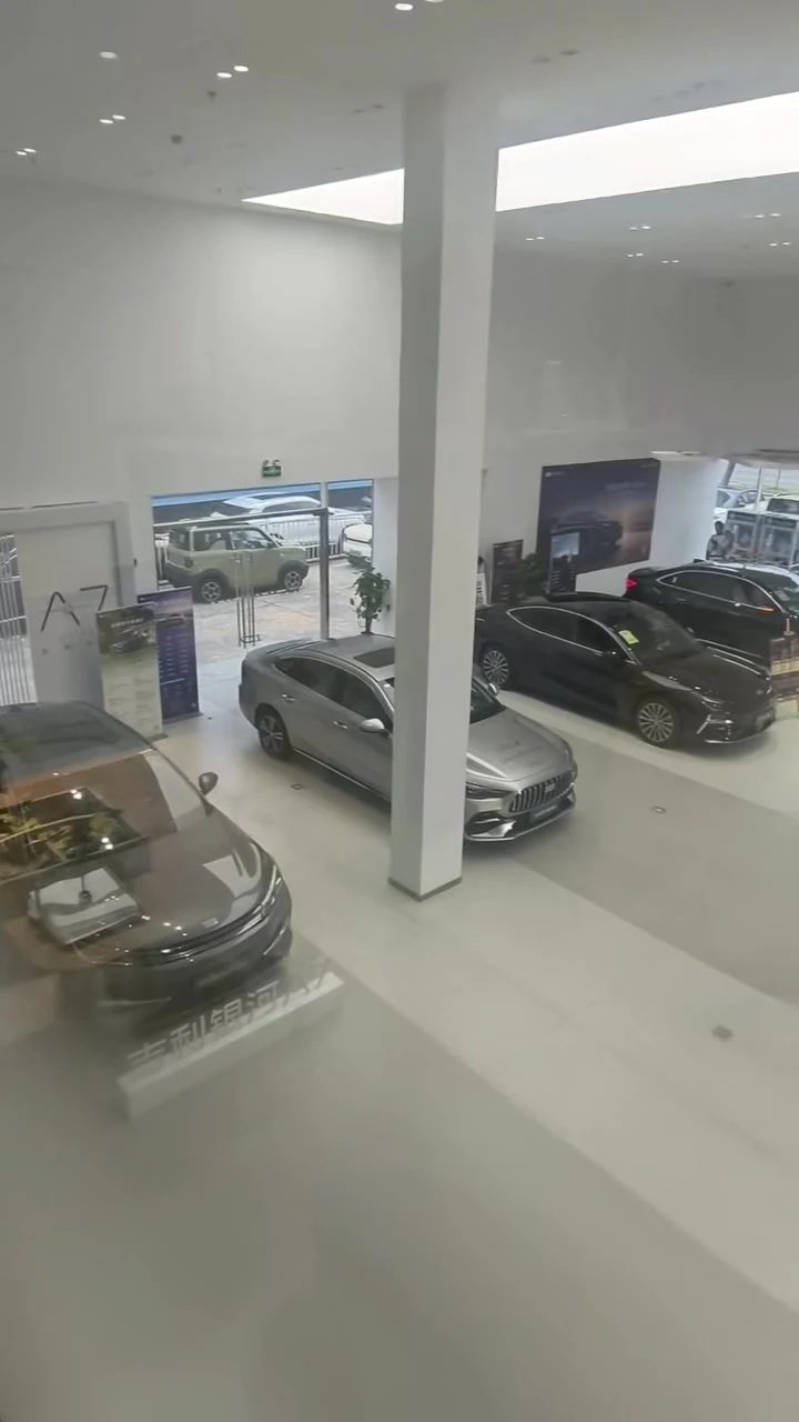 Shanghai 4S dealership showroom floor with new electric vehicles in stock